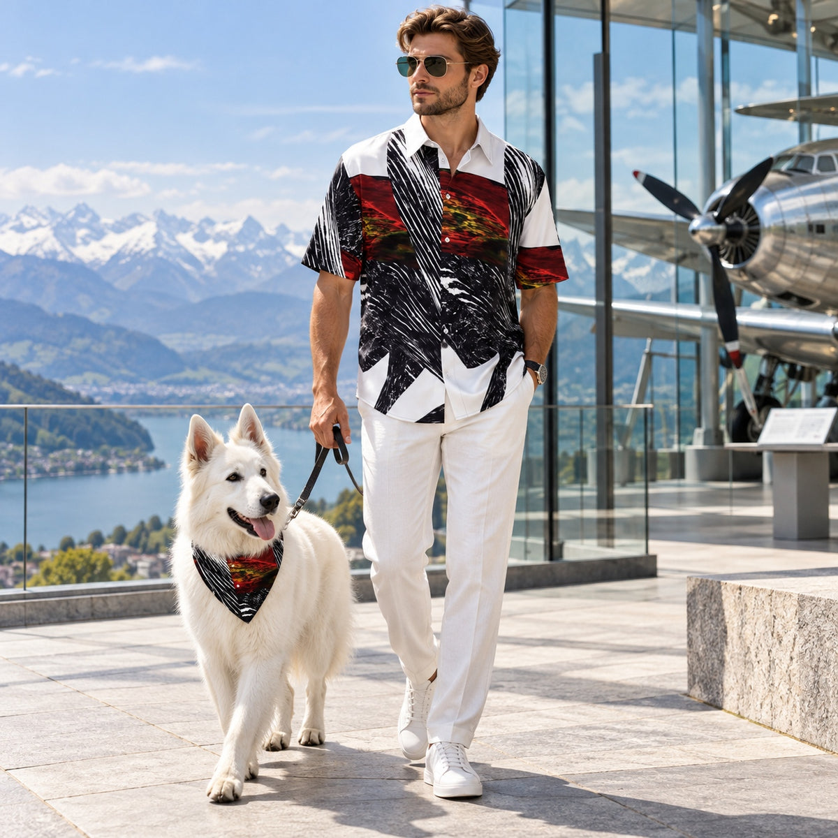Man and white Swiss Shepherd wearing matching Spirit of Flight 1 artwork